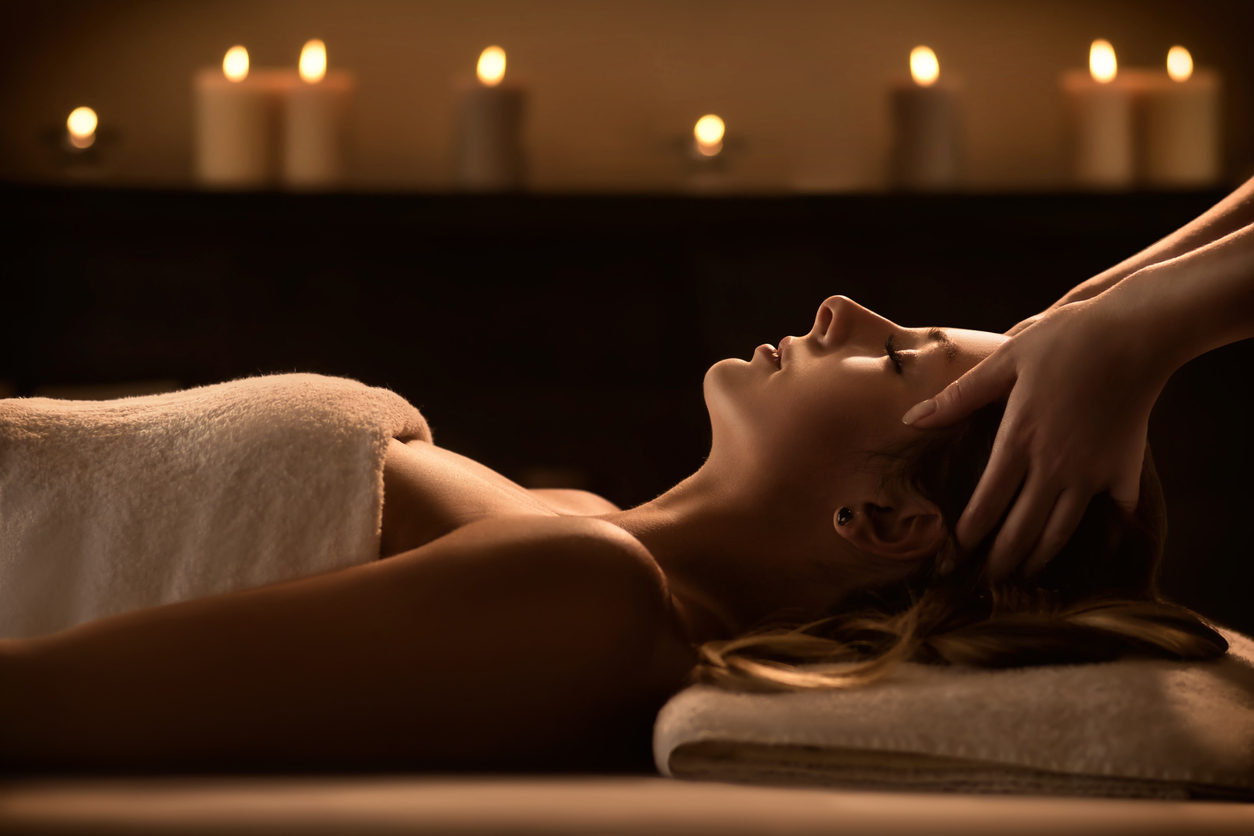 Young woman enjoying massage in a luxury spa resort