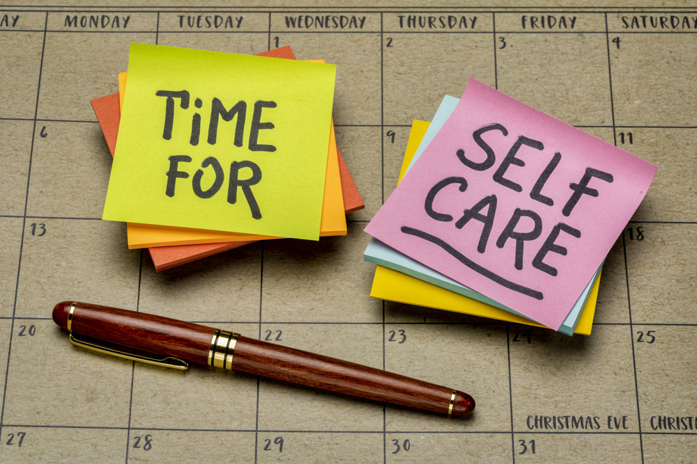 Time for self-care inspirational reminder - handwriting on sticky notes against a desktop calendar, physical and mental health and personal development concept